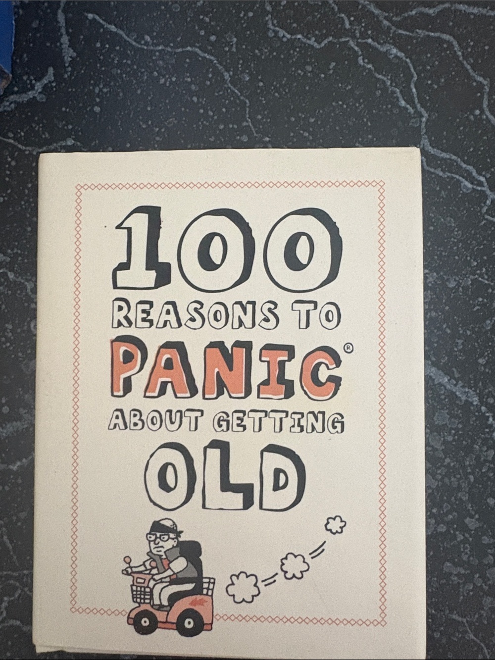 100 Reasons to Panic About Getting Old BOOK- Cream & Orange